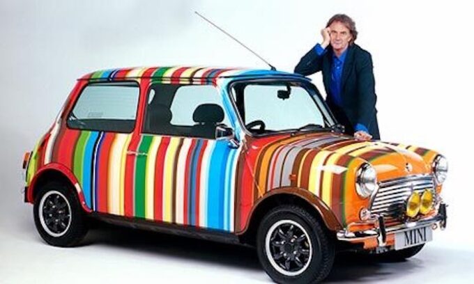 Sir Paul Smith with his design on a classic Mini