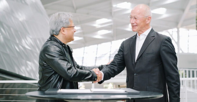 Partnership image featuring Jaguar Land Rover CEO Thierry Bolloré and Nvidia CEO Jensen Huang