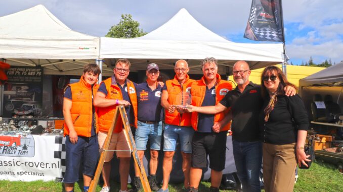 Classic Rover Parts team receives the Best Stand Award trophy at Beaulieu International Autojumble 2026