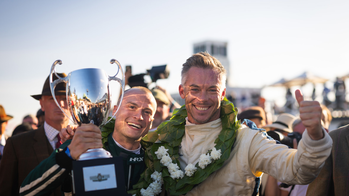Lukas Halusa and André Lotterer holding the RAC TT trophy at the 2026 Goodwood Revival