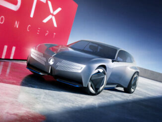 Silver Vauxhall STX Concept estate car, front three-quarter view against a red STX backdrop