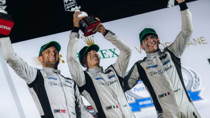 Car Blanche drivers Valentin Hasse Clot, Mattia Drudi and Marco Sorensen celebrate their maiden GTD Pro victory on the Petit Le Mans podium