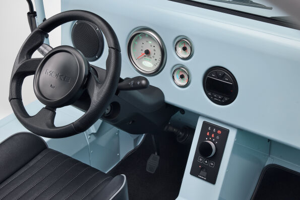 Electric MOKE Mk2 cockpit with steering wheel, round gauges and central control panel