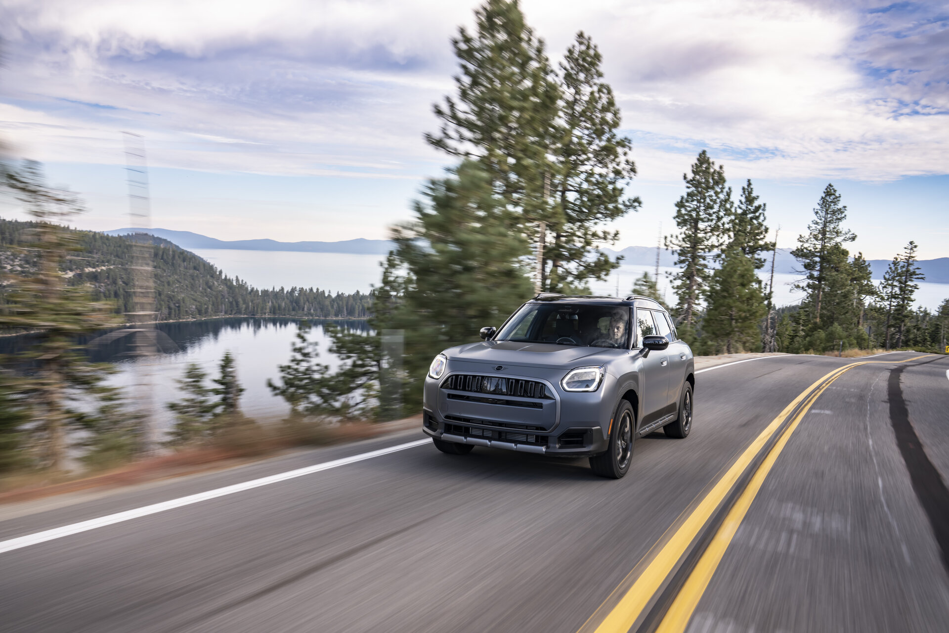 MINI Countryman Untamed Edition driving on a lakeside road