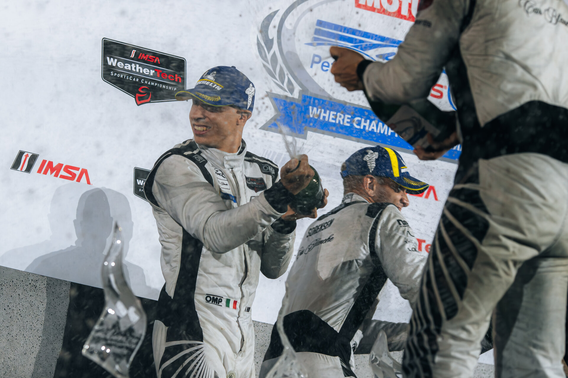 Car Blanche drivers spray champagne on the Petit Le Mans podium