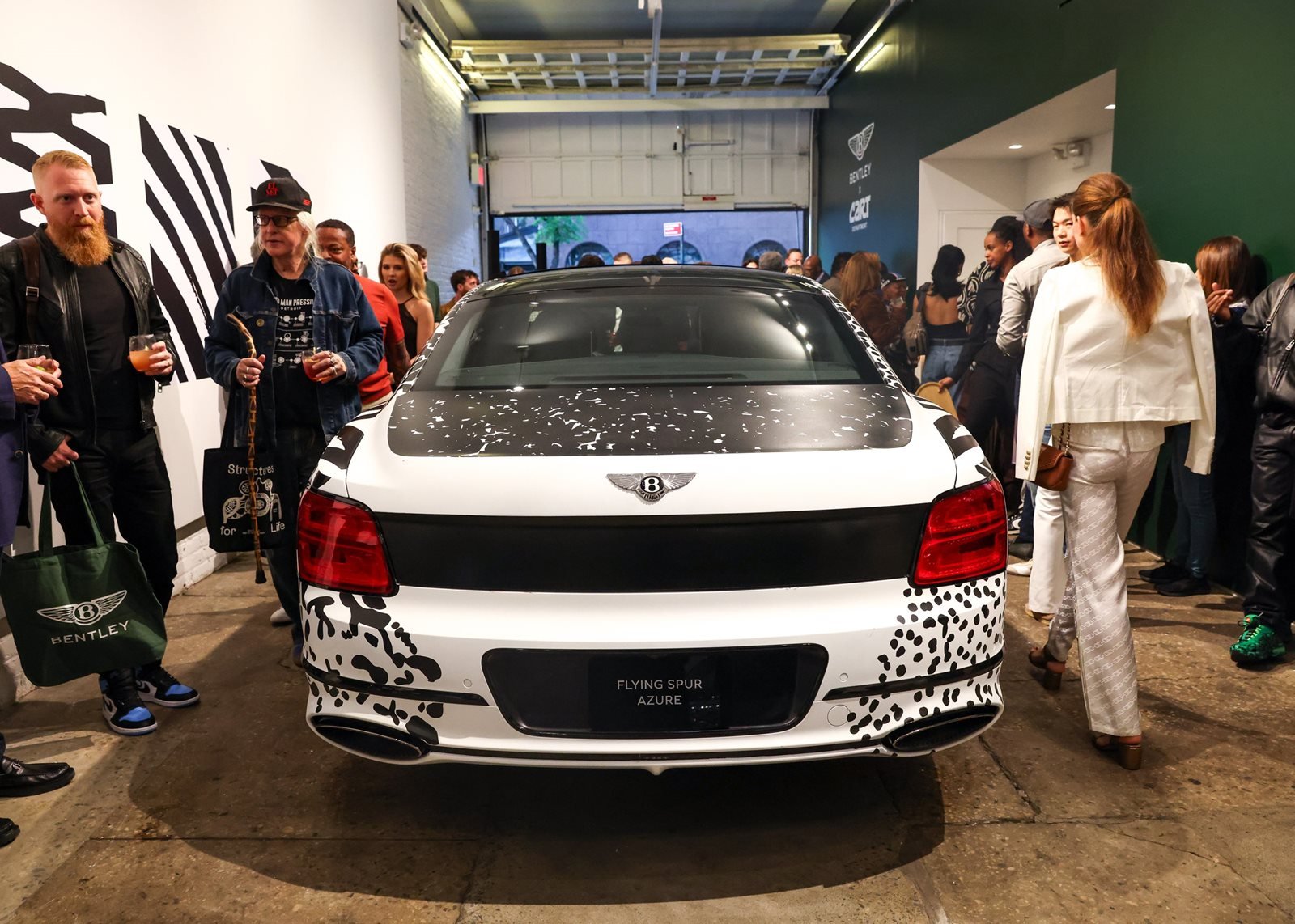 The Flying Spur Art Car by Death Spray Custom surrounded by guests at its US debut at CART Department in New York