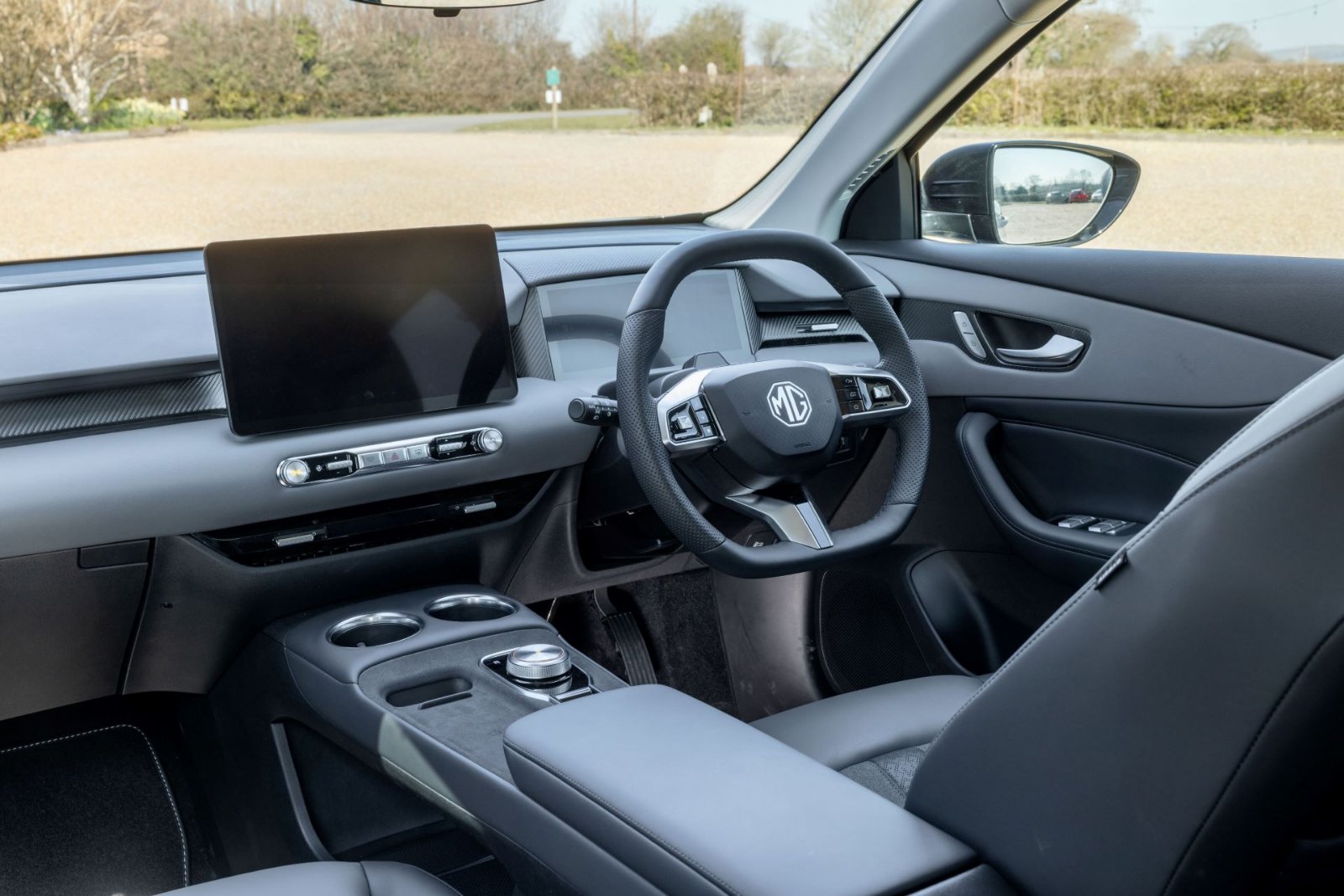 Interior of the MG MGS5 EV showing dashboard, touchscreen and steering wheel