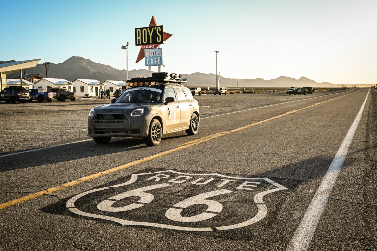The MINI Countryman Untamed Edition parked on Route 66 in front of Roy's Motel and Cafe sign in the desert