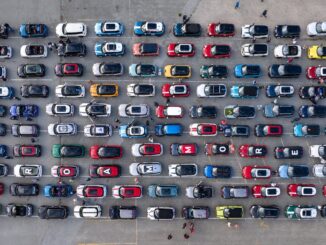 Aerial view of dozens of MINIs parked in neat rows at a MINI Takes the States 2026 rally stop