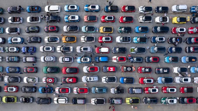 Aerial view of dozens of MINIs parked in neat rows at a MINI Takes the States 2026 rally stop